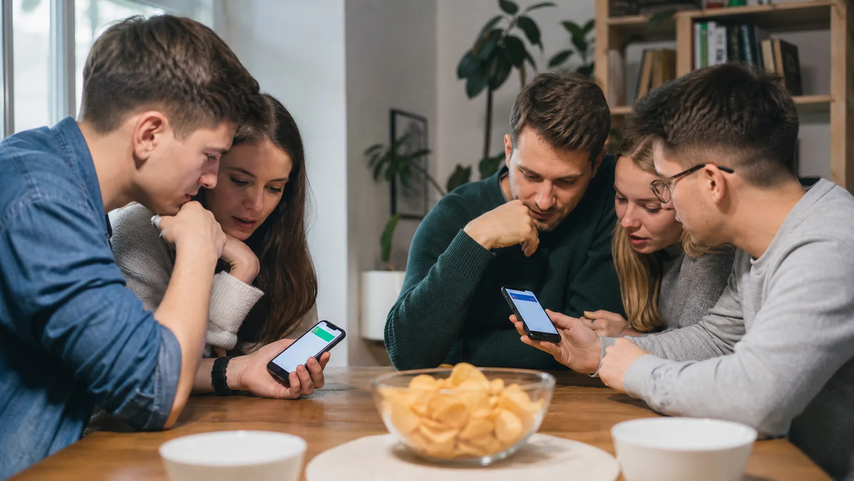 Znajomi odpowiadają w grze quizowej na telefonach